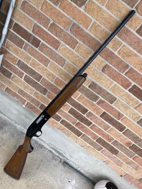 20 gauge engraved Beretta Semi-Auto shotgun